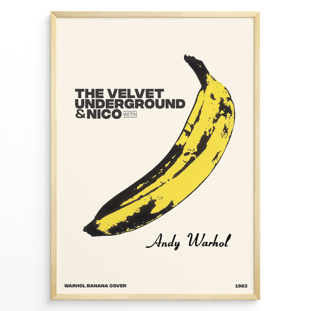 Framed Andy Warhol Banana art poster featuring The Velvet Underground & Nico text on a beige background.