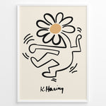Indlæs billede til gallerivisning Framed Keith Haring-style poster showing a black outlined dancing figure with a daisy flower head on a beige background.

