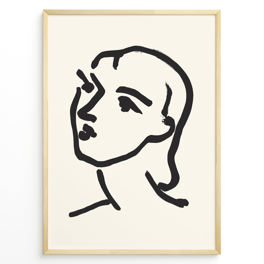 Minimalist black and white abstract face line art print plakat in a modern black frame on cream background.