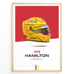 Indlæs billede til gallerivisning Framed poster of Lewis Hamilton’s yellow Ferrari F1 helmet with red background, featuring number 44 and Scuderia Ferrari branding.
