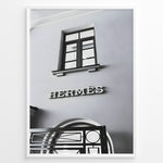 Indlæs billede til gallerivisning Fashion Plakat | Hermès Storefront Minimalist Poster – Black &amp; White Fashion Wall Art Plakaty.dk | Black and white photo of the Hermès storefront with a clean minimalist facade, showing a window above the iconic logo and part of an ornate entryway gate.
