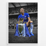 Indlæs billede til gallerivisning John Terry wearing a Chelsea football jersey with the Premier League trophy in front of the Chelsea supporters. The iconic blue colors stand out against the black and white stadium background.
