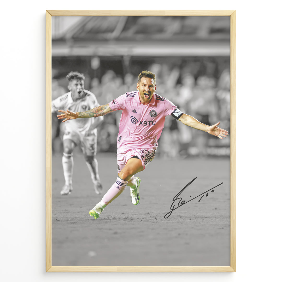 Plakat of Lionel Messi celebrating a goal in pink Inter Miami jersey, arms spread wide, with printed signature and black-and-white background.