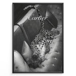 Indlæs billede til gallerivisning Fashion Plakat | Luxurious Cartier-Inspired Art Featuring Leopard on Velvet Sofa Plakaty.dk | Black-and-white image of a leopard lying on its back on a tufted velvet sofa, with the word &quot;Cartier&quot; elegantly overlaid at the top.
