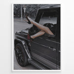 Indlæs billede til gallerivisning Fashion Plakat | Luxury Escape: Legs in High Heels Through Mercedes G-Wagon Window Plakaty.dk | Woman&#39;s legs in high heels sticking out of a Mercedes-Benz G-Wagon window in an urban street scene.
