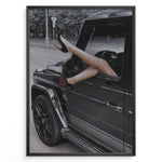 Indlæs billede til gallerivisning Fashion Plakat | Luxury Escape: Legs in High Heels Through Mercedes G-Wagon Window Plakaty.dk | Woman&#39;s legs in high heels sticking out of a Mercedes-Benz G-Wagon window in an urban street scene.
