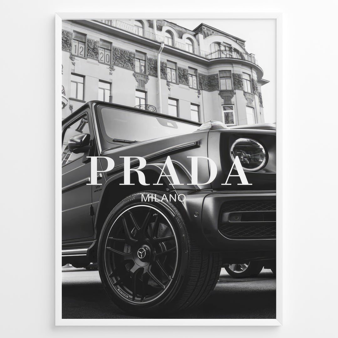 Fashion Plakat | Luxury Lifestyle: Mercedes G-Wagon x Prada Milano Wall Art Plakaty.dk | Black and white framed photo of a Mercedes G-Wagon with Prada Milano text overlay, parked in front of ornate historic buildings.
