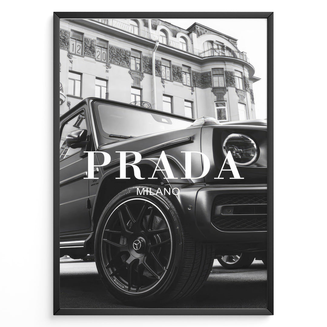Fashion Plakat | Luxury Lifestyle: Mercedes G-Wagon x Prada Milano Wall Art Plakaty.dk | Black and white framed photo of a Mercedes G-Wagon with Prada Milano text overlay, parked in front of ornate historic buildings.
