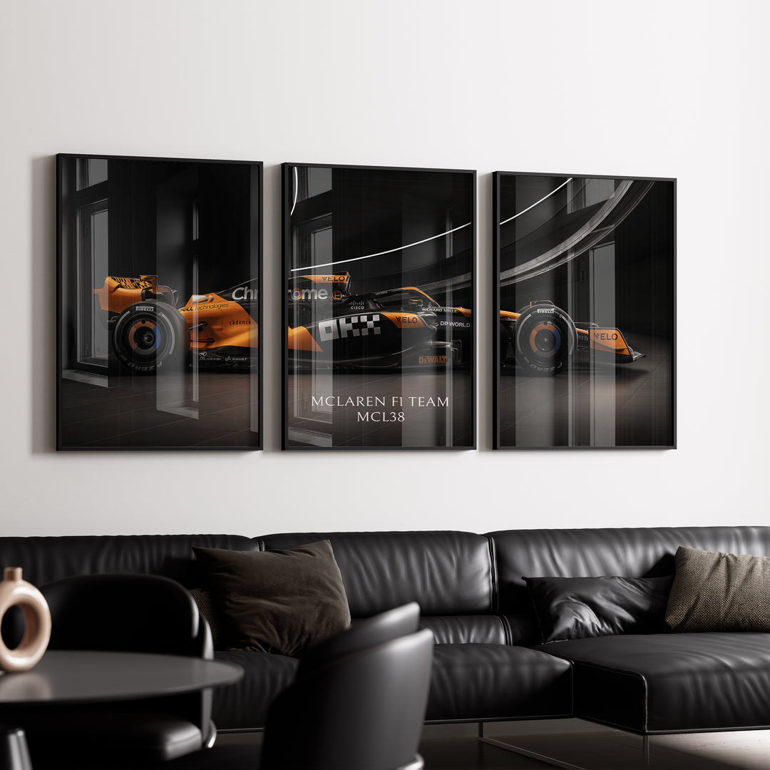 Triptych wall art plakat of the McLaren F1 Team MCL38 Formula 1 car displayed in a stylish living room with black leather furniture.