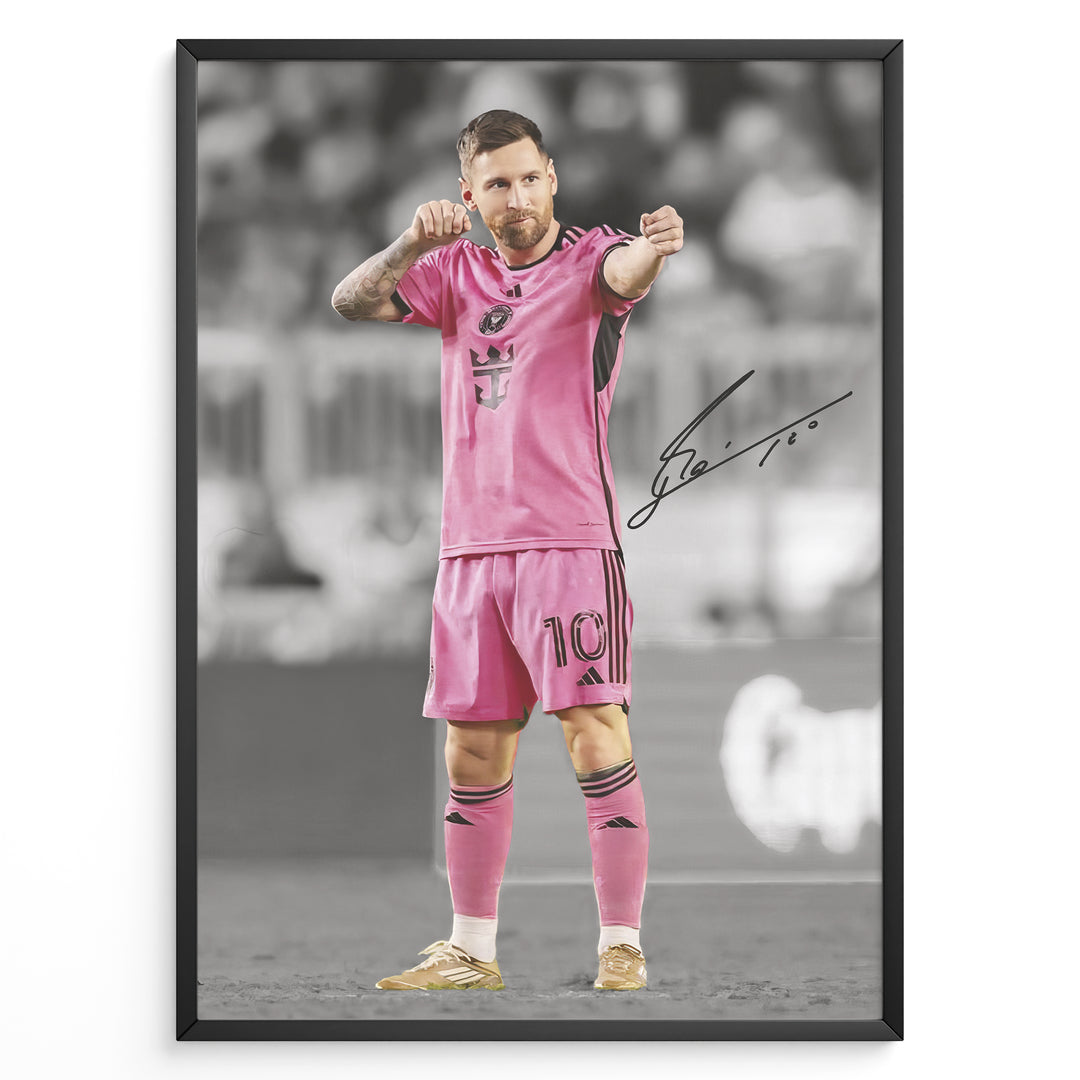 plakat of Lionel Messi in pink Inter Miami jersey pointing forward, with printed signature and black-and-white background.