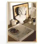 Indlæs billede til gallerivisning Fashion Plakat | Modern Vanity Scene with Sculptural Bust, Jewelry, and Perfume – Aesthetic Interior Print Plakaty.dk | Stylish vanity setup with a white classical bust, gold jewelry on a marble tray, designer perfumes, and crystal glassware in warm lighting.
