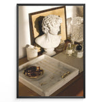 Indlæs billede til gallerivisning Fashion Plakat | Modern Vanity Scene with Sculptural Bust, Jewelry, and Perfume – Aesthetic Interior Print Plakaty.dk | Stylish vanity setup with a white classical bust, gold jewelry on a marble tray, designer perfumes, and crystal glassware in warm lighting.
