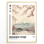 Indlæs billede til gallerivisning Japanske plakater | Vintage-style illustration of Mount Fuji with cherry blossoms falling over a peaceful lake and distant forest, featuring the text “Tokyo 1988.”
