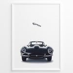 Indlæs billede til gallerivisning Framed minimalist poster of a black Jaguar E-Type classic sports car front view with the Jaguar leaping logo above on a white background.
