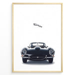 Indlæs billede til gallerivisning Framed minimalist poster of a black Jaguar E-Type classic sports car front view with the Jaguar leaping logo above on a white background.
