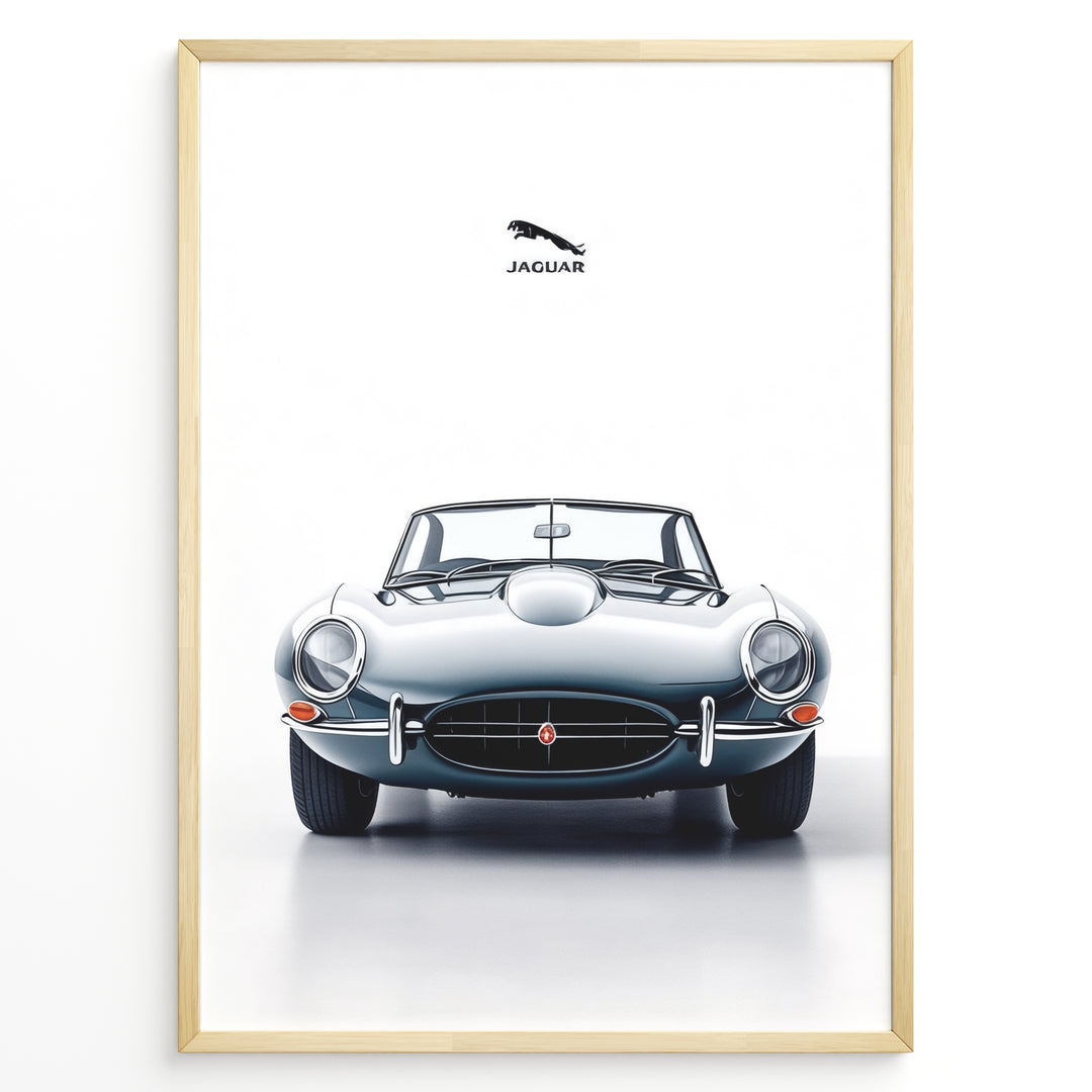 Framed minimalist poster of a silver Jaguar E-Type convertible classic car front view with Jaguar logo above on a white background.