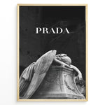 Indlæs billede til gallerivisning Fashion Plakat | Prada-Inspired Angel Statue – Fashion and Art Black and White Poster Plakaty.dk | Black and white artwork of a mourning angel statue with the word &quot;PRADA&quot; above, blending classical art and modern fashion

