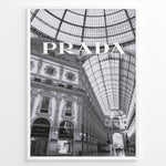 Indlæs billede til gallerivisning Fashion Plakat | Prada Boutique in Galleria Vittorio Emanuele II – Milan, Italy Plakaty.dk | Black and white photo of the Prada store inside the Galleria Vittorio Emanuele II in Milan, showcasing ornate architecture and a large glass-domed ceiling.
