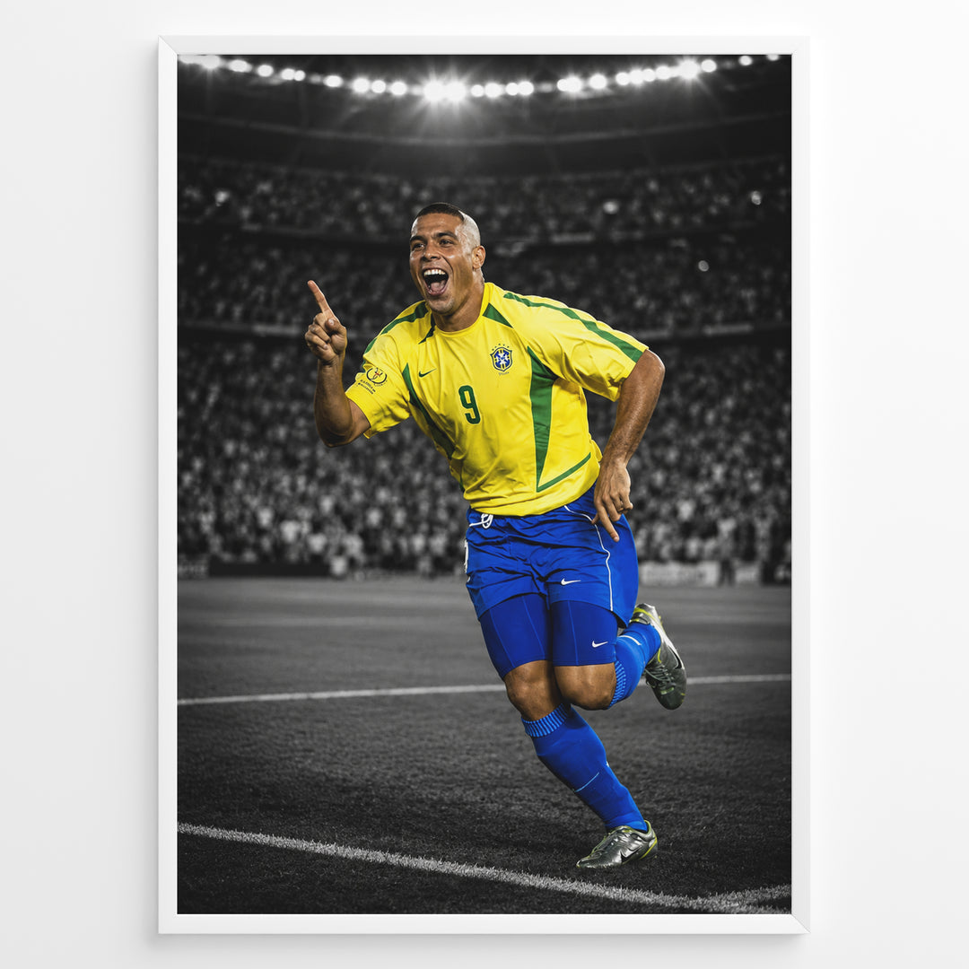 Ronaldo Nazário wearing the iconic yellow Brazil football jersey with number 9 while celebrating on the pitch. The black and white stadium background highlights the Brazilian colors.