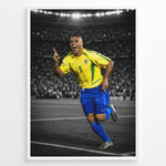 Indlæs billede til gallerivisning Ronaldo Nazário wearing the iconic yellow Brazil football jersey with number 9 while celebrating on the pitch. The black and white stadium background highlights the Brazilian colors.
