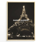 Indlæs billede til gallerivisning Fashion Plakat | Saint Laurent Eiffel Tower Night View – Paris Fashion Wall Art Plakaty.dk | Illuminated Eiffel Tower at night with &quot;Saint Laurent Paris&quot; logo centered in white text.
