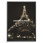 Indlæs billede til gallerivisning Fashion Plakat | Saint Laurent Eiffel Tower Night View – Paris Fashion Wall Art Plakaty.dk | Illuminated Eiffel Tower at night with &quot;Saint Laurent Paris&quot; logo centered in white text.
