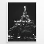 Indlæs billede til gallerivisning Fashion Plakat | Saint Laurent Eiffel Tower Poster – Black &amp; White Paris Fashion Print Plakaty.dk | Black and white photo of the Eiffel Tower illuminated at night with “Saint Laurent Paris” text overlay, capturing the essence of French fashion and elegance.
