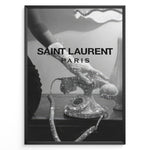 Indlæs billede til gallerivisning Fashion Plakat | Saint Laurent Glamour Art Featuring Glitter Phone and Elegant Hand Plakaty.dk | Black-and-white image of a sparkling vintage rotary phone being held by a glittering, elegant hand, with &quot;SAINT LAURENT PARIS&quot; overlaid in bold text.
