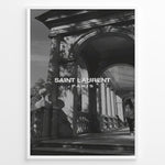 Indlæs billede til gallerivisning Fashion Plakat | Saint Laurent Paris – Architectural Elegance in Monochrome Plakaty.dk | Black and white photo of classical architecture with arches and columns, overlaid with the Saint Laurent Paris logo, conveying elegance and luxury.
