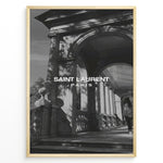 Indlæs billede til gallerivisning Fashion Plakat | Saint Laurent Paris – Architectural Elegance in Monochrome Plakaty.dk | Black and white photo of classical architecture with arches and columns, overlaid with the Saint Laurent Paris logo, conveying elegance and luxury.
