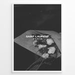 Indlæs billede til gallerivisning Fashion Plakat | Saint Laurent Paris – Monochrome Elegance Poster Plakaty.dk | Black and white Saint Laurent Paris poster featuring a bouquet of white roses wrapped in paper.
