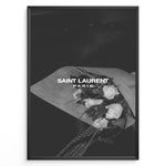 Indlæs billede til gallerivisning Fashion Plakat | Saint Laurent Paris – Monochrome Elegance Poster Plakaty.dk | Black and white Saint Laurent Paris poster featuring a bouquet of white roses wrapped in paper.

