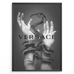 Indlæs billede til gallerivisning Fashion Plakat | Versace-Inspired Art Featuring Serpent and Marble Hands Plakaty.dk | Black-and-white image of a snake wrapped around two upward-reaching marble-textured hands, with the word &quot;VERSACE&quot; overlaid in bold, semi-blurred text.
