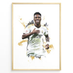 Indlæs billede til gallerivisning Framed watercolor-style plakat of Vinícius Jr. celebrating in a Real Madrid jersey with a gold artistic background
