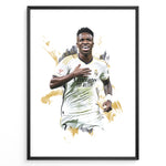 Indlæs billede til gallerivisning Framed watercolor-style plakat of Vinícius Jr. celebrating in a Real Madrid jersey with a gold artistic background
