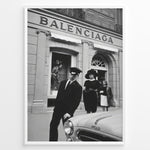Indlæs billede til gallerivisning Fashion Plakat | Vintage Balenciaga Boutique – Paris Street Fashion Poster Plakaty.dk | Black and white photo of the Balenciaga boutique in Paris with a chauffeur, two stylish women, and a vintage car in the foreground.

