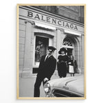 Indlæs billede til gallerivisning Fashion Plakat | Vintage Balenciaga Boutique – Paris Street Fashion Poster Plakaty.dk | Black and white photo of the Balenciaga boutique in Paris with a chauffeur, two stylish women, and a vintage car in the foreground.
