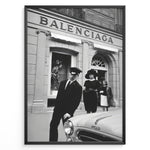 Indlæs billede til gallerivisning Fashion Plakat | Vintage Balenciaga Boutique – Paris Street Fashion Poster Plakaty.dk | Black and white photo of the Balenciaga boutique in Paris with a chauffeur, two stylish women, and a vintage car in the foreground.
