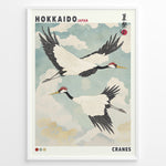 Indlæs billede til gallerivisning Japanske plakater | Vintage-style Japanese poster featuring two red-crowned cranes flying in a cloudy sky, with the text &quot;Hokkaido Japan&quot; and traditional Japanese characters referencing a summer festival.
