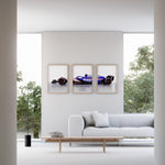 Indlæs billede til gallerivisning Triptych wall art plakat of the Visa Cash App RB F1 Team VCARB 01 Formula 1 car displayed in a stylish living room with black leather furniture and modern décor.
