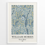 Indlæs billede til gallerivisning William Morris Sweet Briar 1887 botanical floral pattern art print with blue and beige leaves and flowers in black frame plakat.
