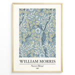Indlæs billede til gallerivisning William Morris Sweet Briar 1887 botanical floral pattern art print with blue and beige leaves and flowers in black frame plakat.
