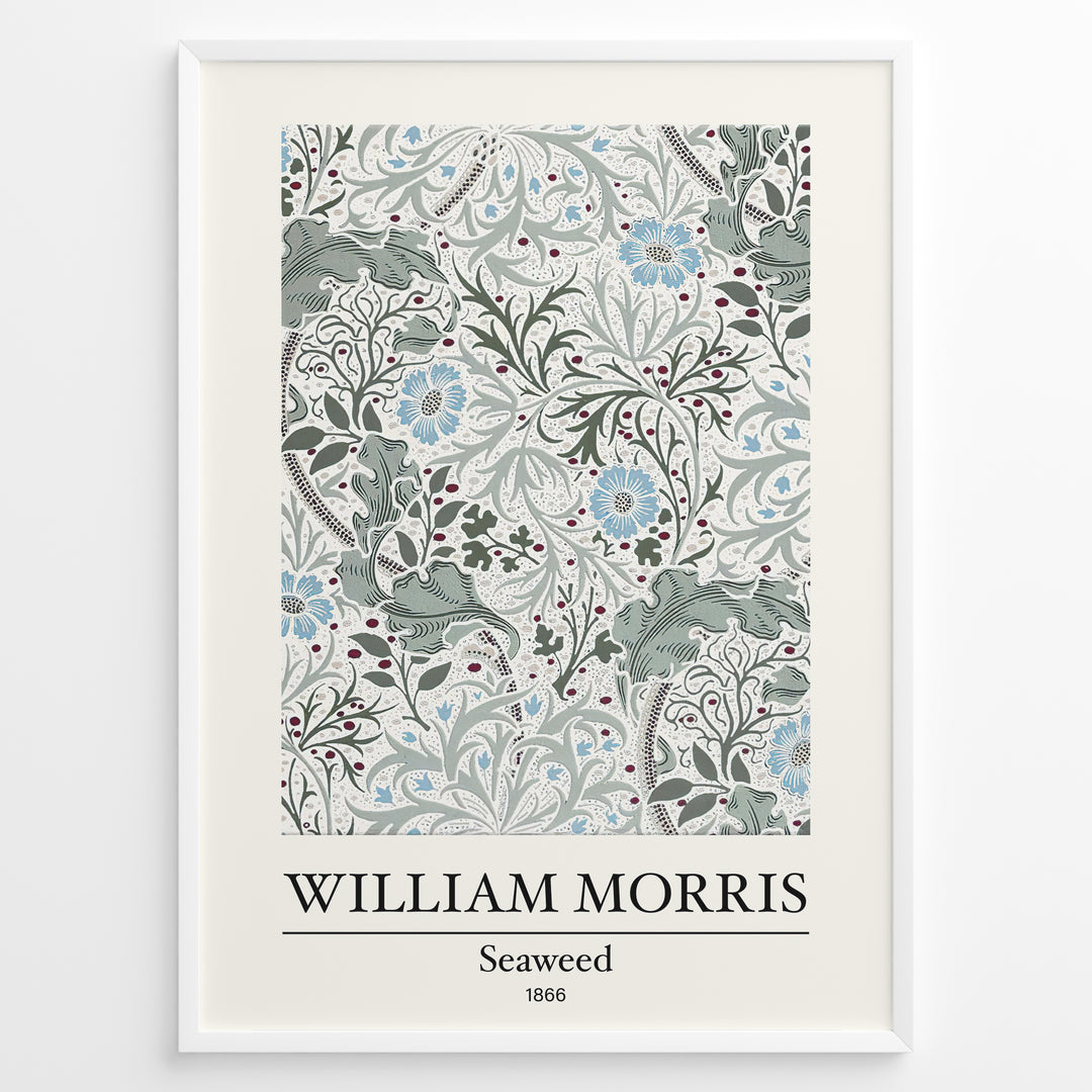 Framed William Morris Seaweed 1866 art print plakat featuring intricate seaweed-inspired floral and leaf motifs in blue and green on a cream background.