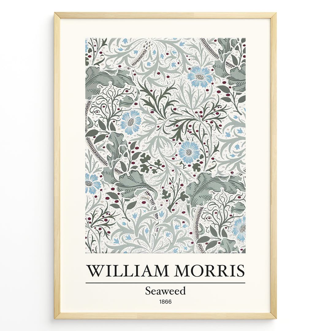 Framed William Morris Seaweed 1866 art print plakat featuring intricate seaweed-inspired floral and leaf motifs in blue and green on a cream background.