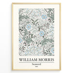 Indlæs billede til gallerivisning Framed William Morris Seaweed 1866 art print plakat featuring intricate seaweed-inspired floral and leaf motifs in blue and green on a cream background.
