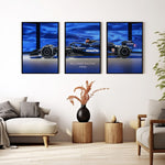 Indlæs billede til gallerivisning Triptych wall art plakat of the Williams Racing FW46 Formula 1 car with a bold blue background, displayed in a contemporary living room with black leather furniture.
