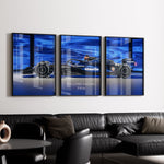 Indlæs billede til gallerivisning Triptych wall art plakat of the Williams Racing FW46 Formula 1 car with a bold blue background, displayed in a contemporary living room with black leather furniture.
