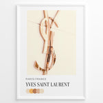 Indlæs billede til gallerivisning Fashion Plakat | Yves Saint Laurent Paris – Rose Gold Emblem Poster Plakaty.dk | Rose gold Yves Saint Laurent logo on a soft beige background with a neutral color palette and Paris/France label beneath.
