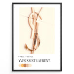 Indlæs billede til gallerivisning Fashion Plakat | Yves Saint Laurent Paris – Rose Gold Emblem Poster Plakaty.dk | Rose gold Yves Saint Laurent logo on a soft beige background with a neutral color palette and Paris/France label beneath.
