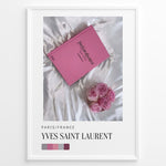 Indlæs billede til gallerivisning Fashion Plakat | Yves Saint Laurent Pink Book on Silk – Paris Fashion Decor Plakaty.dk | Yves Saint Laurent pink Catwalk book placed on white silk fabric with pink roses beside it, representing Parisian luxury and soft elegance.
